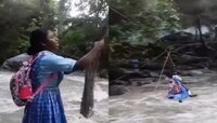नदी ओलांडण्यासाठी विद्यार्थिनीचा दोरीला लटकून प्रवास...पाहा थरकाप उडविणारा Video