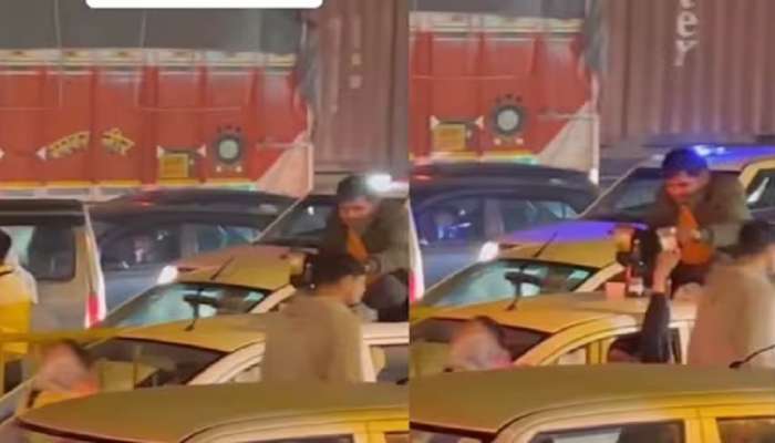 Viral Video : भर रस्त्यात गाडीच्या छतावरून बसून मारले पेग वर पेग, व्हिडिओ व्हायरल