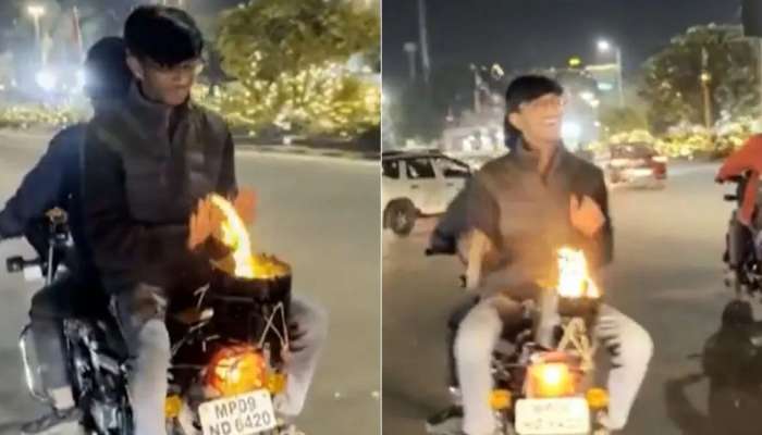 Viral Video : थंडीपासून बचावासाठी तरूणाने चालत्या बाईकवर लावली आग, पाहा VIDEO