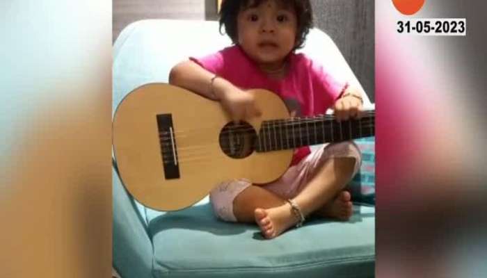 Small girl Playing Guitar On Poem